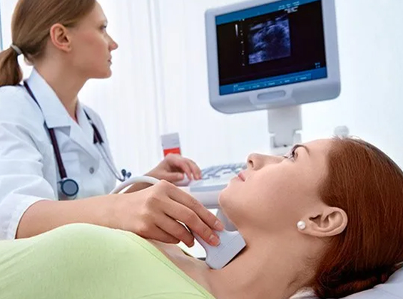 Doctor using ultrasound on patient